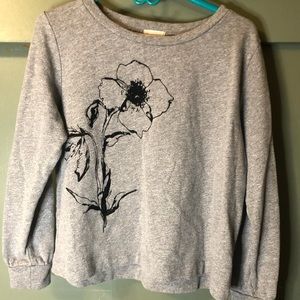 Gray sweatshirt with black printing of flower